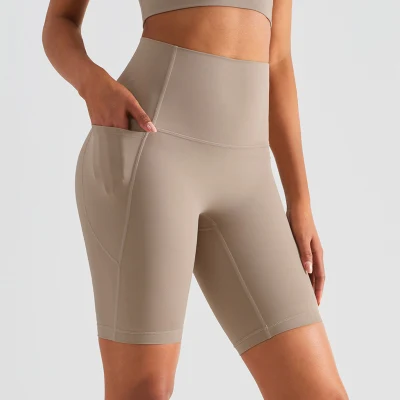 Atacado OEM/ODM Mulheres Treino Cintura Alta Yoga Shorts esportivos de bicicleta com bolso lateral sem dedo de camelo Academia Fitness Running Shorts de ciclismo sem costura